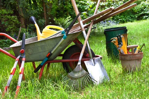 Home various gardening tools in the garden background